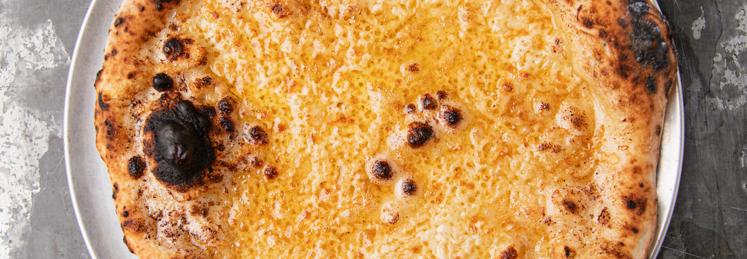 Cheesy Miso Garlic Bread - Roccbox recipe poster image