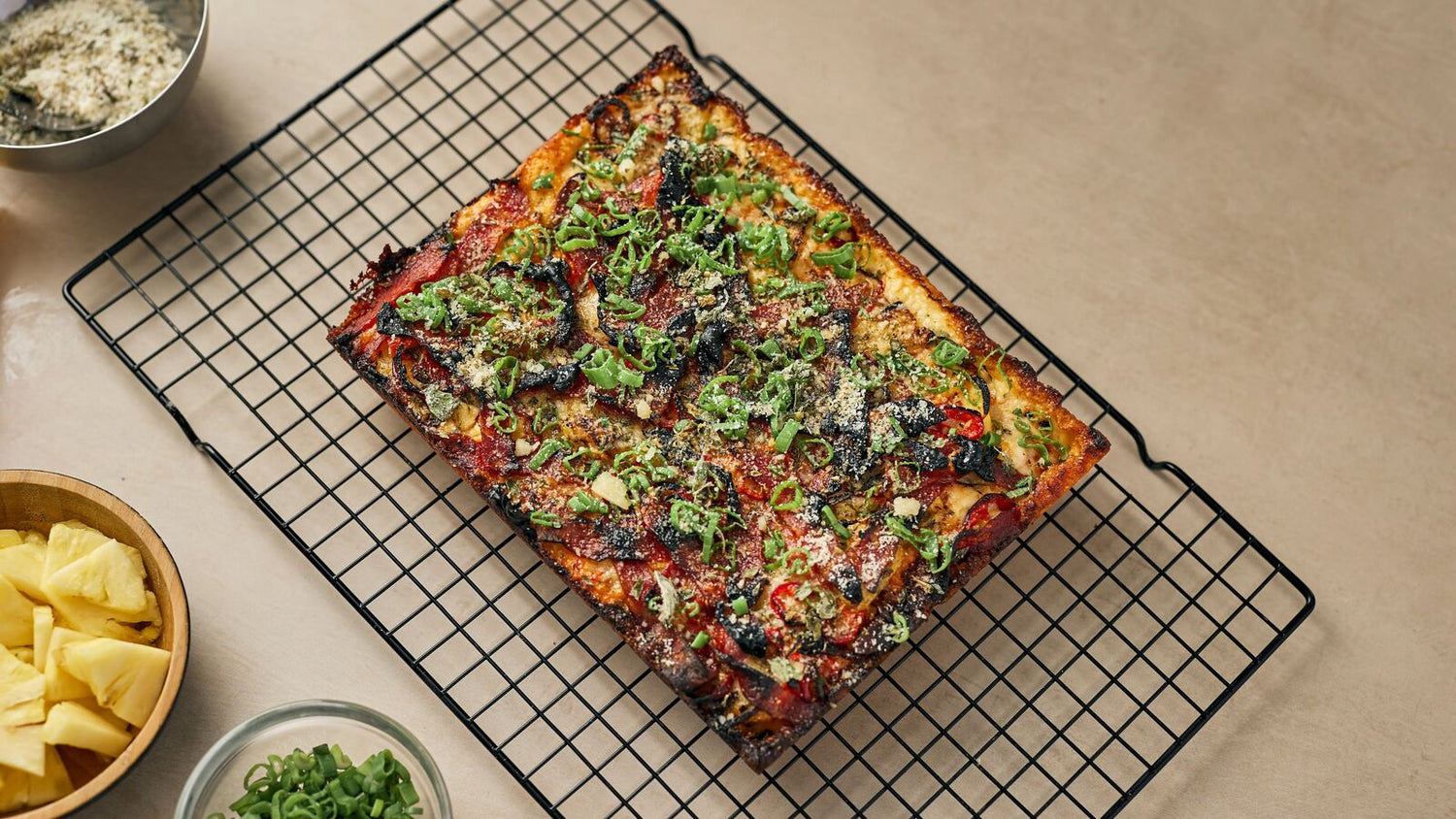 Hawaiian Pizza on a wire rack