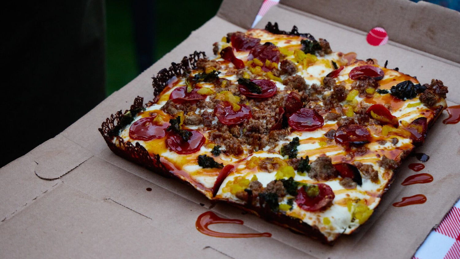 Detroit Pepperoni and Sausage Pizza on cardboard