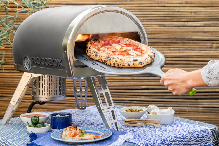 Roccbox pizza oven on table