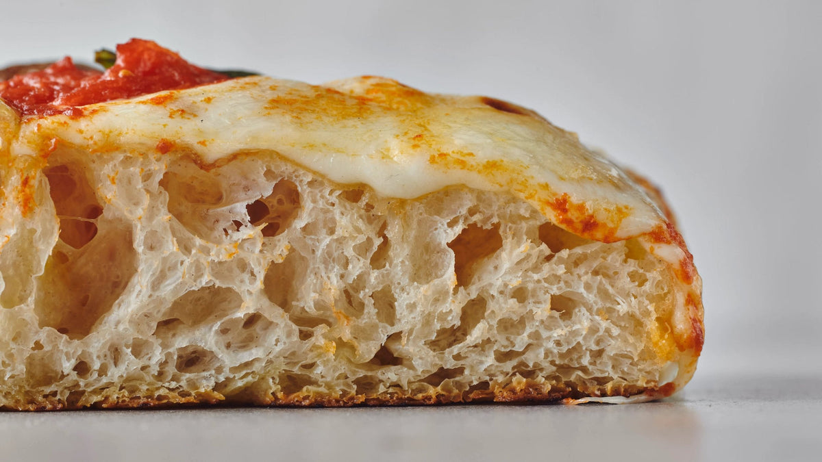 Pizza slice side view.
