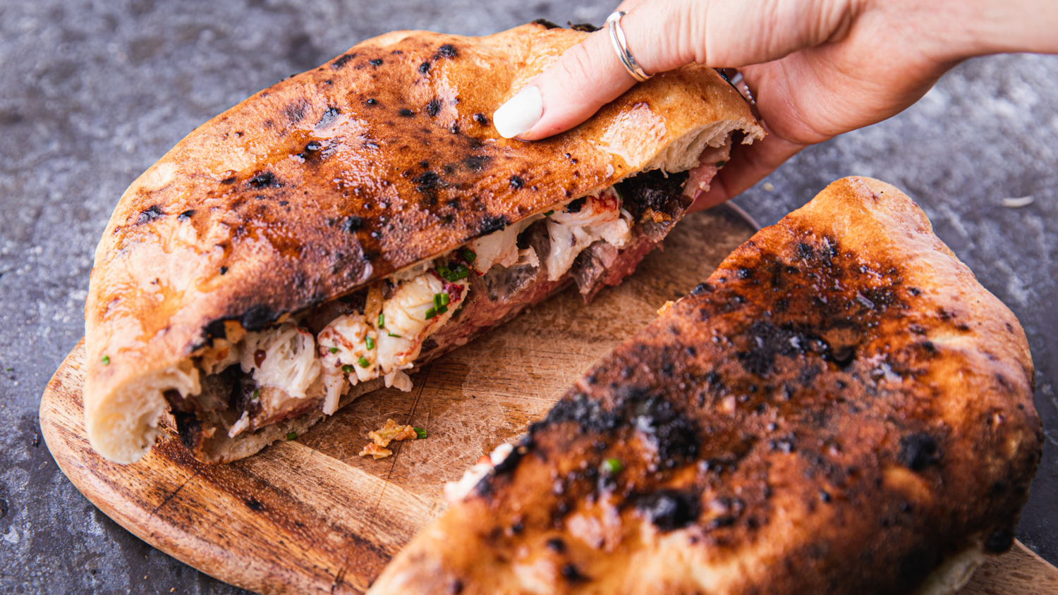 Steak and Lobster Panuozzo cut in half